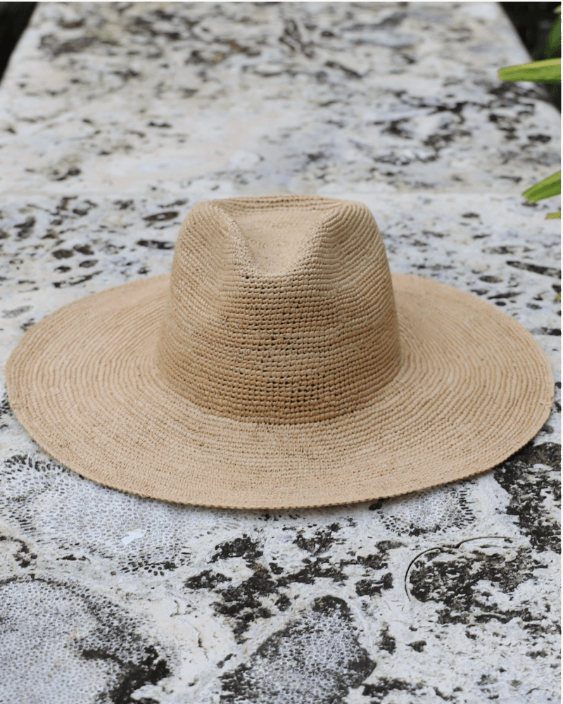 Beige foldable wide brim panama toquilla straw hat with teardrop crown