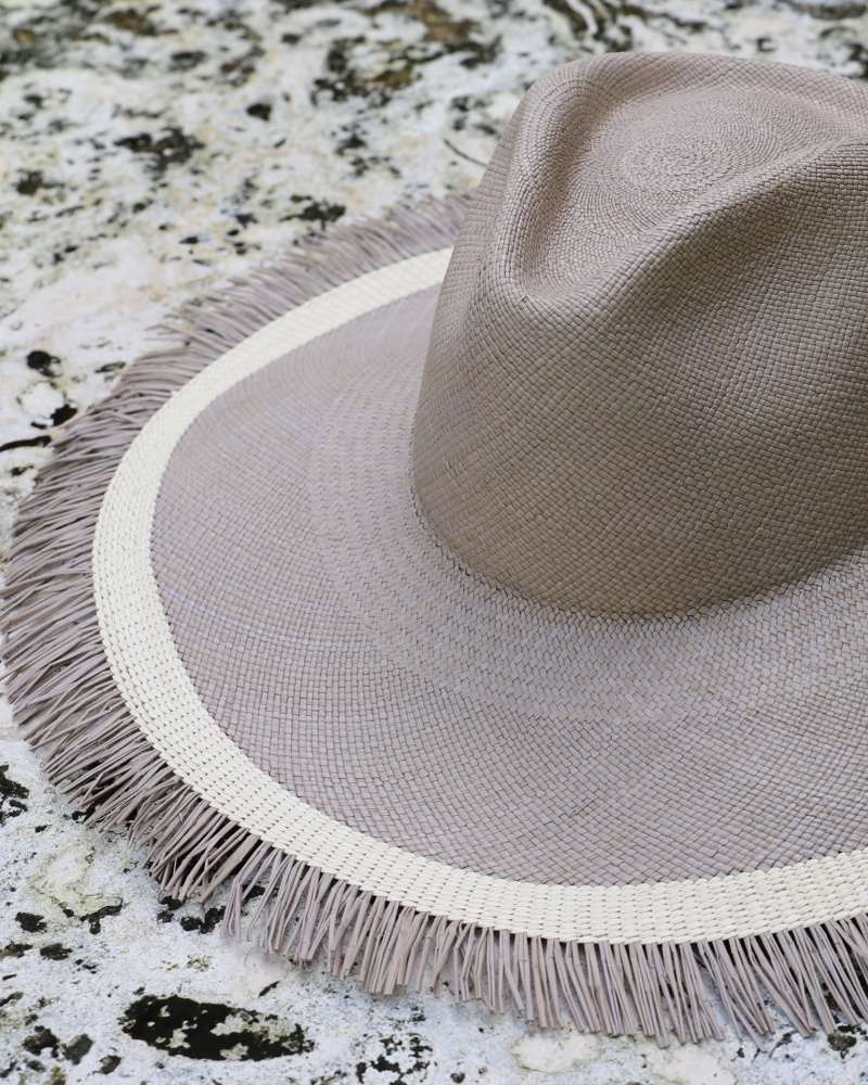 Grey and white teardrop crown wide brim panama toquilla straw hat with fringe