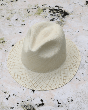 Ivory panama toquilla straw hat with pinched crown and beige-patterned brim